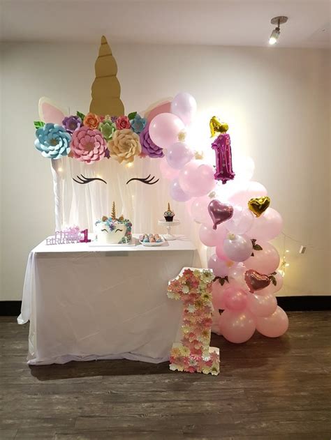Unicorn Set Up For A Sweet First Birthday Party First Birthday Party