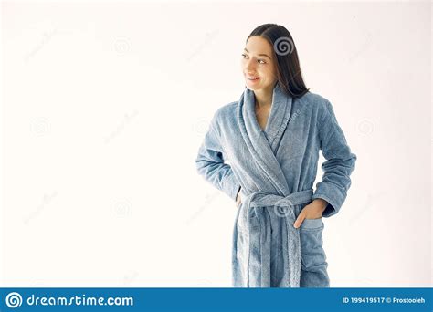 Beautiful Girl Standing In A Studio In A Blue Bathrobe Stock Image