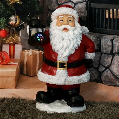The Holiday Aisle® Journeying Santa Claus Statue Polyresin Figurine