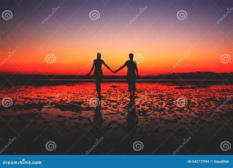 Two People In Love Walking On The Beach Stock Photo Image Of February
