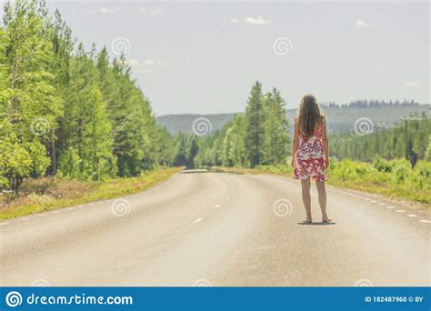 A Woman In A Summer Dress On A Country Road Stock Photo Image Of