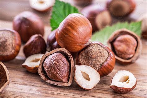 Hazelnuts And Hazelnut Leaves On The Containing Brown Closeup And