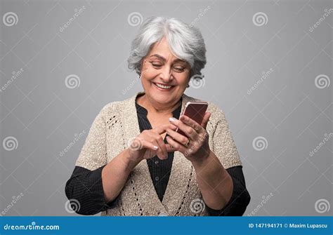 Laughing Senior Lady Using Smartphone Stock Image Image Of Laughing