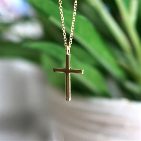 A Small Simple Cross Necklace This Does Not Have Any Stones To Make It