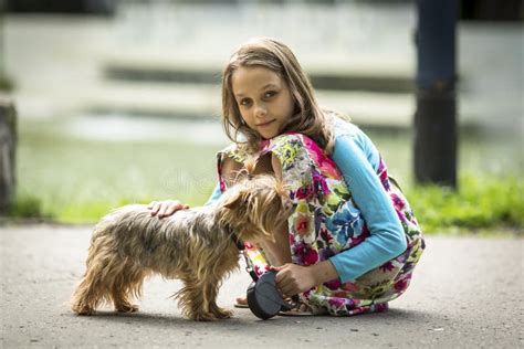 Girl With Doggy On Fall Maple Leaf Outdoors Emotional Support