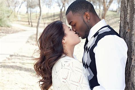 Interracial Couple Kissing Bildbanksfoton Och Bilder Getty Images Photos
