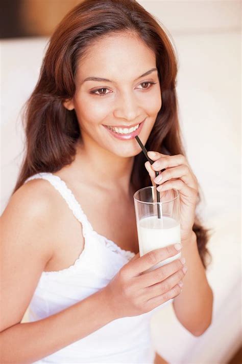 Woman Drinking Milk Photograph By Ian Hooton Science Photo Library