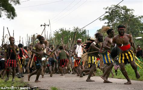 two killed as violence erupts between tribes armed with bows and arrows in volatile indonesian