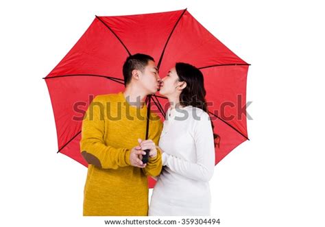 Couple Kissing Under Umbrella Against White Stock Photo 359304494