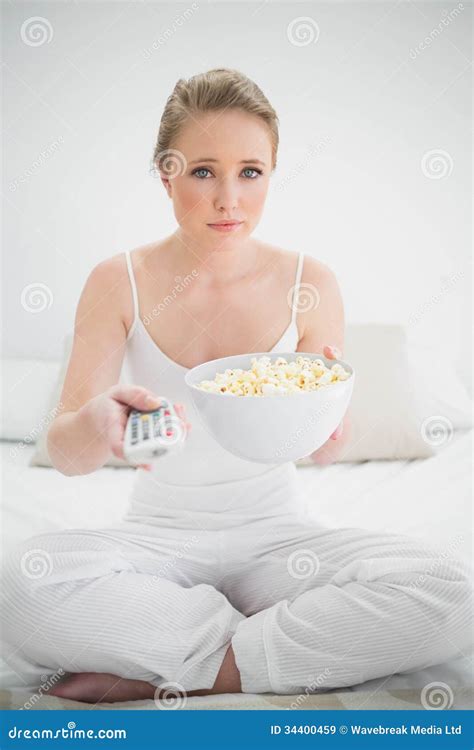 Natural Stern Blonde Holding Remote And Popcorn Stock Image Image Of Indoors Duvet 34400459