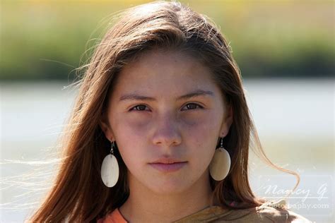 A Young Native American Indian Teenager Girl Walking Along A Rivers