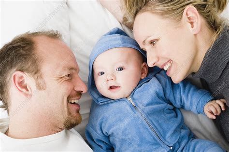 Baby Laying Between Dad And Mom Stock Image F003 2212 Science