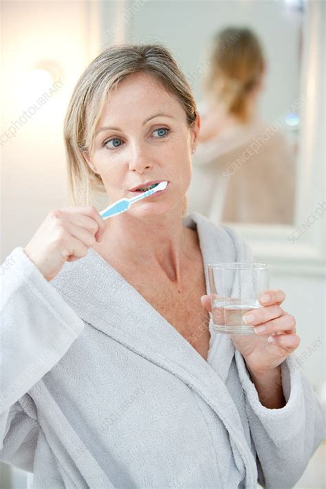 Woman Brushing Her Teeth Stock Image C0327102 Science Photo Library