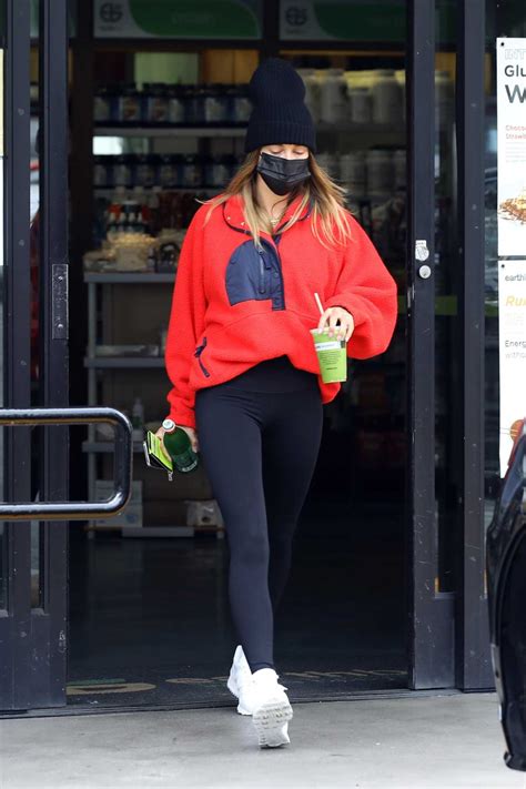 Hailey Bieber In A Red Sweatshirt Leaves The Earth Bar In West