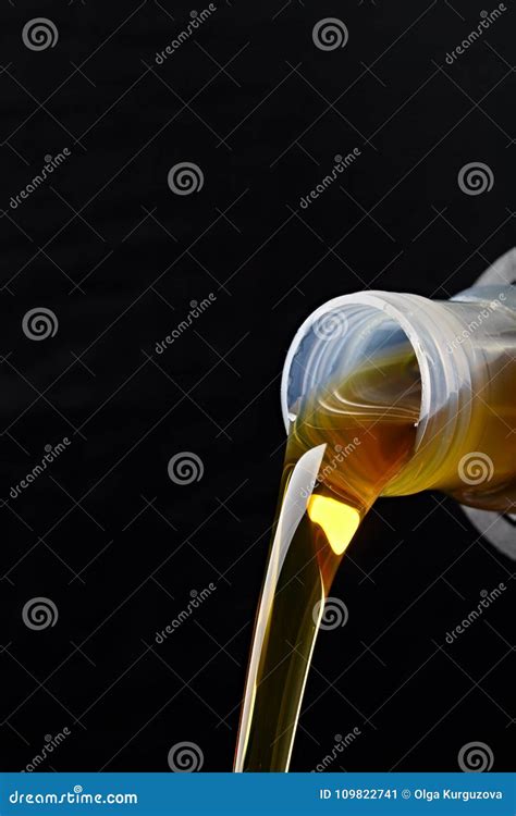 Pouring Synthetic Oils For Car Engine On Dark Background Stock Image