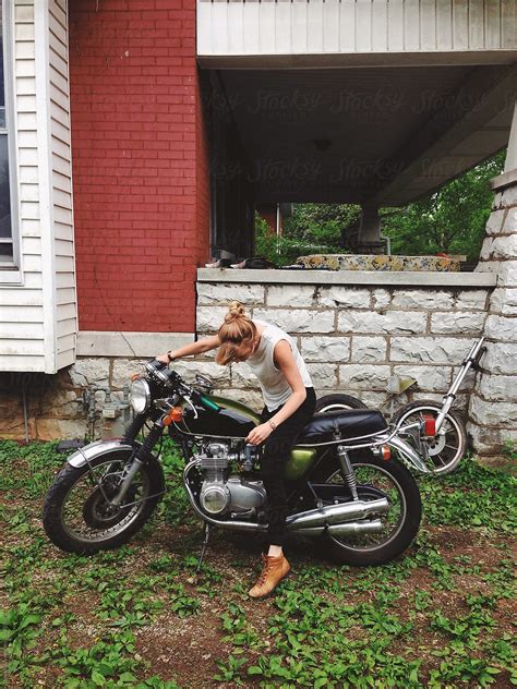 Young Woman Sitting On A Motorcycle By Stocksy Contributor Laura