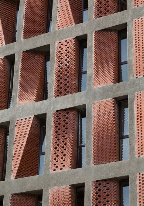 Angled Screens Of Perforated Brick Provide Ventilation And Shade For