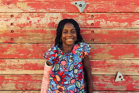 Smiling African American Girl With A Cast By A Climbing Wall Del Colaborador De Stocksy Gabi