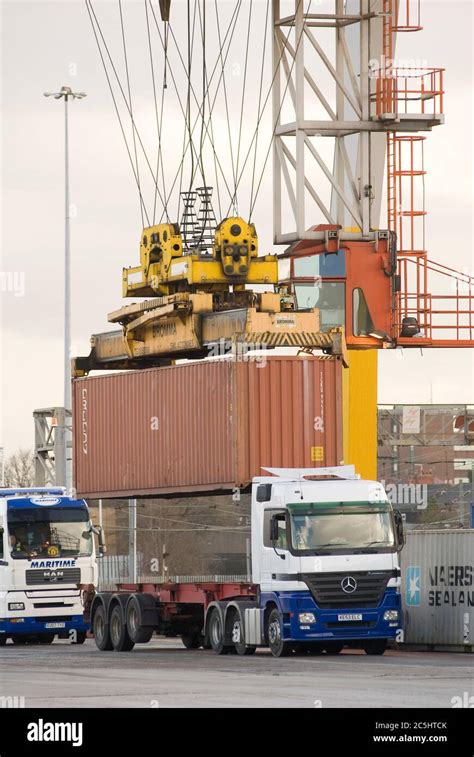 Rail Mounted Crane Being Used To Load And Unload Shipping Containers On