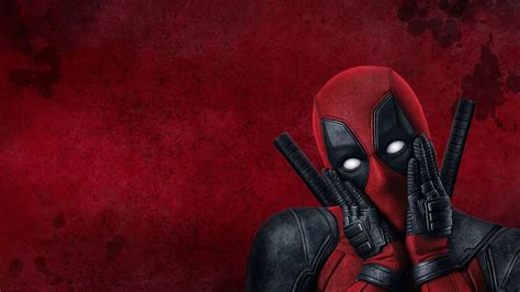 deadpool with weapons in red background hd deadpool wallpapers hd wallpapers id 65460
