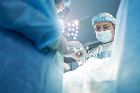 Concentrated Surgeon Working On Abdomen Operation In Surgery Room Stock Image Image Of