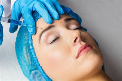 Woman Receiving Botox Injection On Her Forehead Stock Photo Image Of