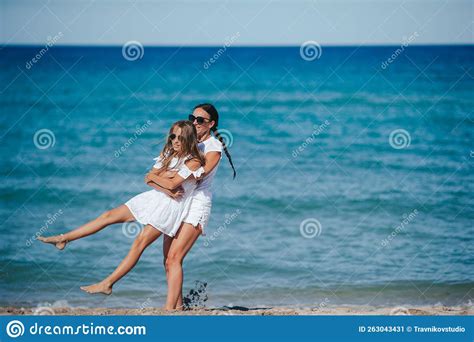 Young Happy Mother And And Her Daughter Having Fun On The Beach Stock Image Image Of Daughter