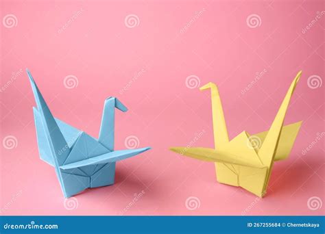 Origami Art Colorful Handmade Paper Cranes On Pink Background Stock