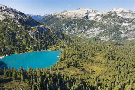 Aerial View Of Turquoise Lake In A Mountain Setting Cavf76924