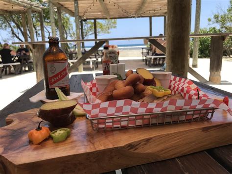 In jamaica, the tainos established an estimated 200 villages by the time christopher columbus set foot on maroons. History and how to eat Jamaican jerk and festival bread