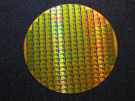 Silicon Wafer Rm7000 64bit Mips Cpu Circa 1999 With A Packaged Cpu Chip