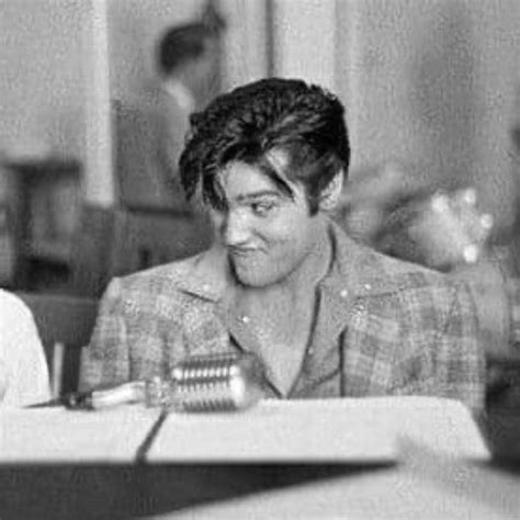Black And White Photograph Of Two People Sitting At A Table In Front Of Each Other