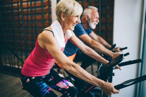 Happy Fit Mature Woman Man Cycling Exercise Bikes Stock Photos Free Royalty Free Stock