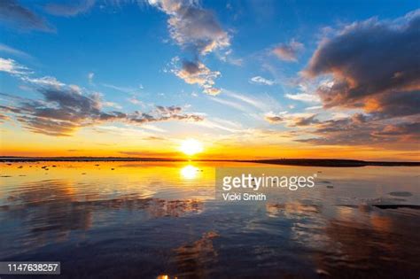 Multicolored Tranquil Sunrise Over Water High Res Stock Photo Getty