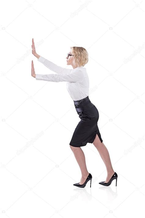A Businesswoman Pushing An Imaginary Wall Side View Isolated Concept