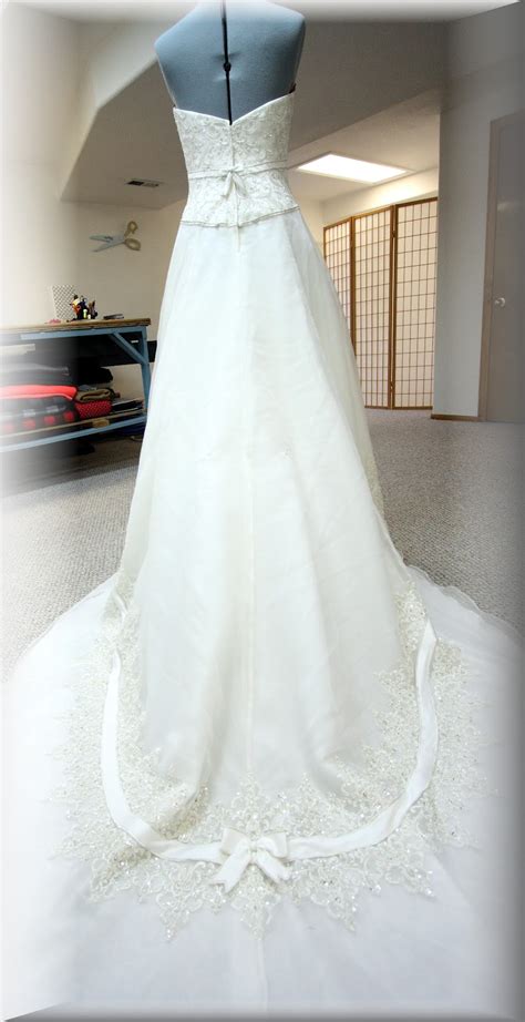 Then, she proudly wears it on her special d His, Hers and Ours DIY: WEDDING GOWN BUSTLE