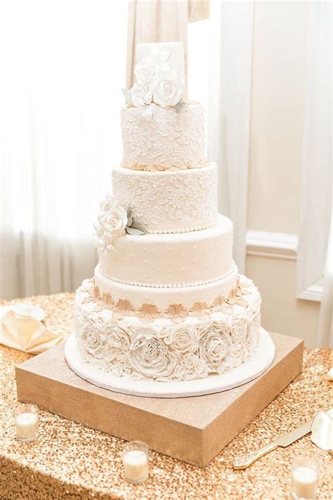 This Elegant Cream And Gold Lace Wedding Cake With Sugar Flowers Is