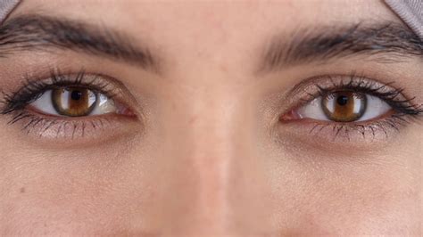 Extreme Close Up Shot Of Eyes Of Beautiful Young Woman Looking At