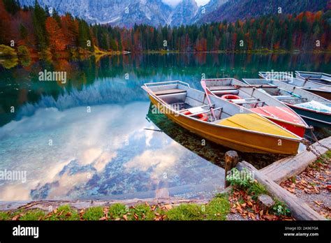Alpine Lake And Colorful Boats Near Slovenian Italy Border Lake Fusine