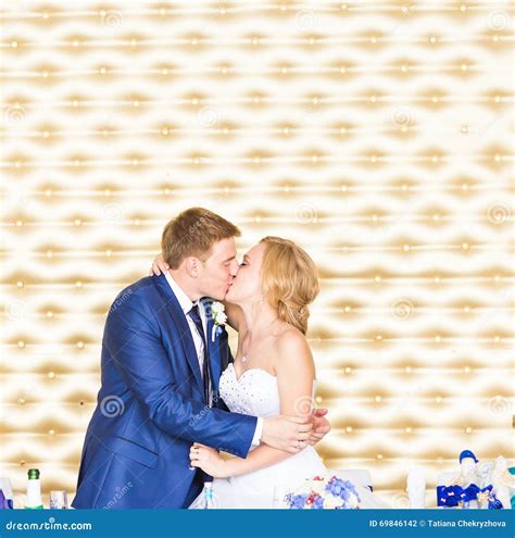 Stylish Gorgeous Happy Bride And Groom Kissing At Wedding Reception
