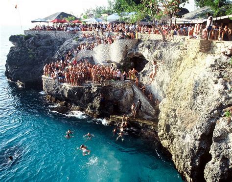 Ricks Cafe Negril Jamaica Extreme Action Jumps From 3048 Meters To A Narrow Slit Cliff