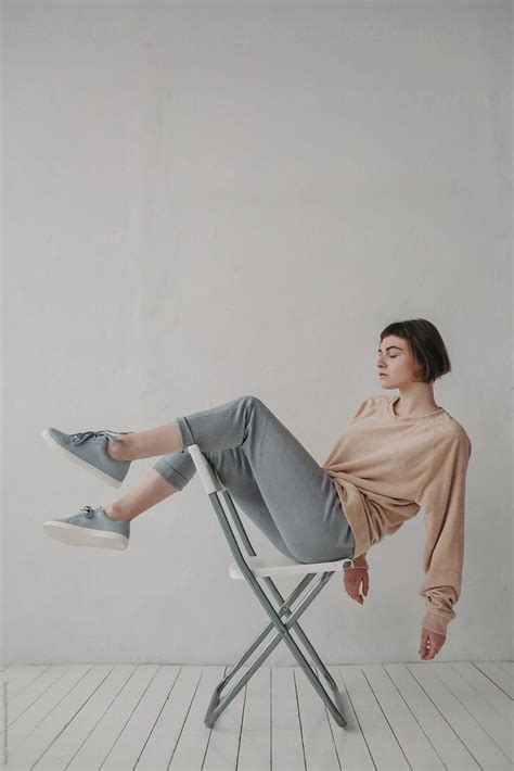 Stylish Woman Sitting On The White Chair By Sergey Filimonov Sitting