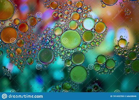 Abstract Background With Vibrant Colours Oil Drops In Water Close Colorful And Artistic