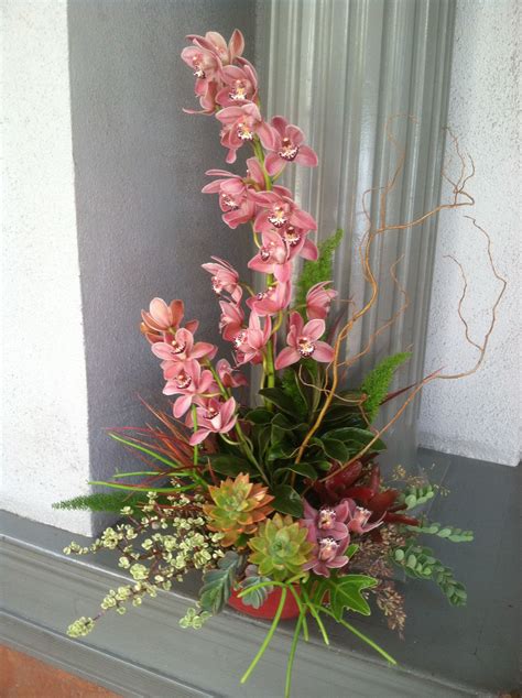 Towering Cymbidiums Stand Out Among Succulents And Cut Foliage Flower Fabulous By Hm Florals