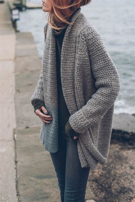Layering A Funnel Neck Sweater And Chunky Knit Cardigan Creates A