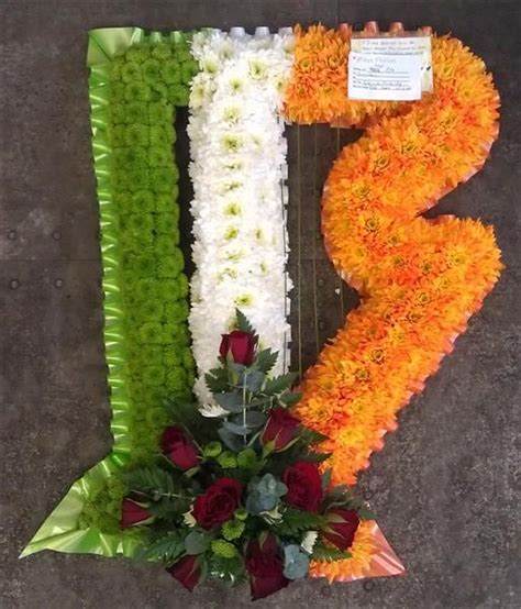 Whether you choose traditional funeral flowers or a custom design, this expression of compassion and support is a meaningful gesture that is sure to be appreciated. Harp as Irish Flag Tribute | Funeral flower arrangements ...
