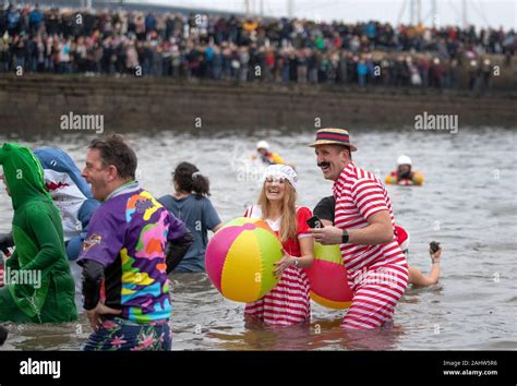 People Take Part In The Loony Dook New Years Day Dip In The Firth Of