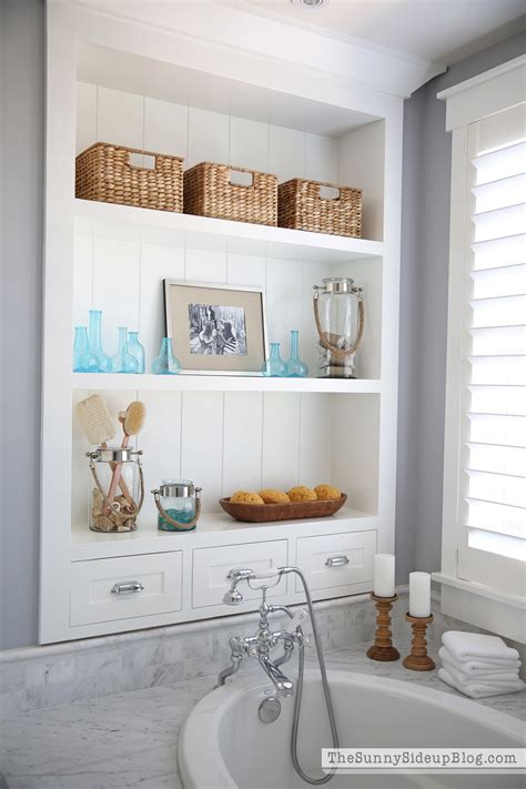 Metal accent shelves and round wall shelves can bring in modern elements to a bedroom, bathroom, living room or entryway. Master Bathroom Shelves/Tub - The Sunny Side Up Blog