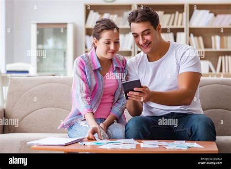 Young family discussing family finances Stock Photo - Alamy