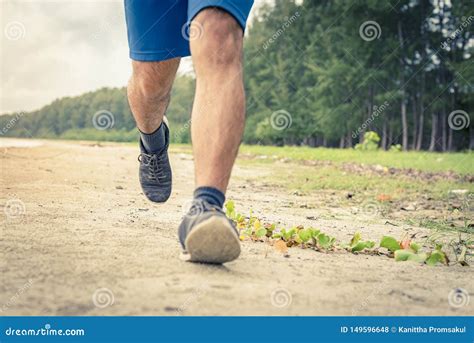 Man Runner Legs Running Close Up On Shoe Men Jogging On The Beach Stock Photo Image Of Black
